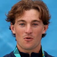 Taylor Nye holds up his medal on the stand after winning Gold at the Men's Park Skateboarding Final at the 2023 Pan American Games in Santiago, Chile.