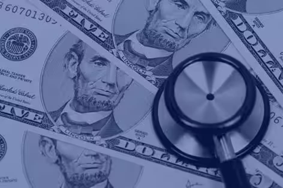 Stethoscope resting on money