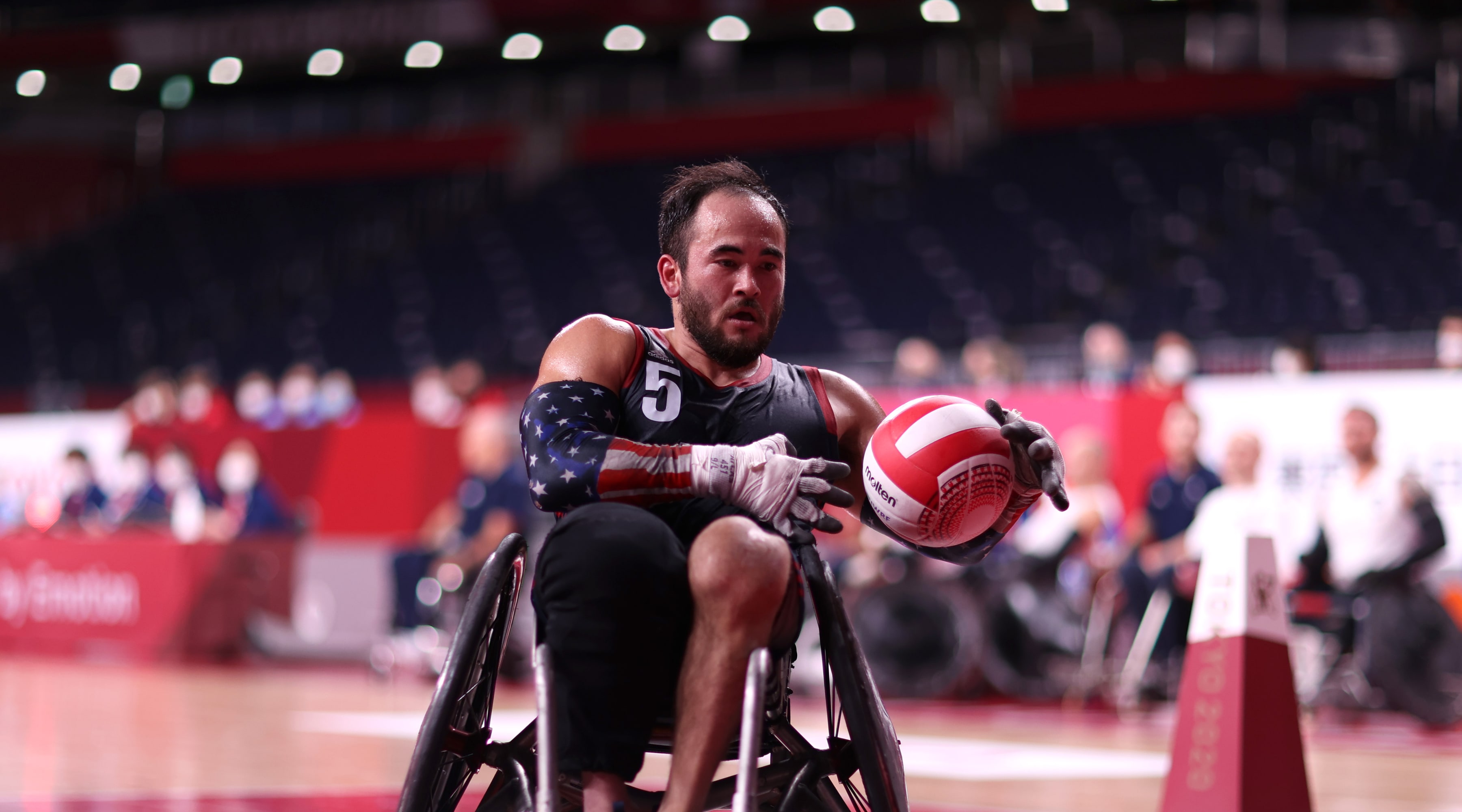 Chuck Aoki on the podium at the Tokyo 2020 Paralympic Games