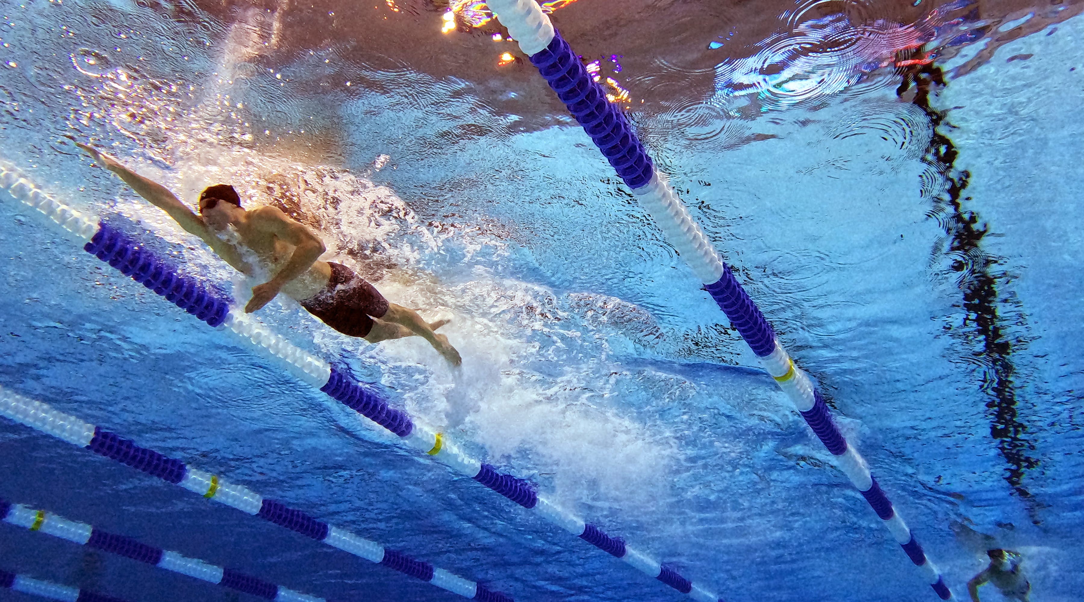 A photograph of Bobby Finke swimming taken from underwater