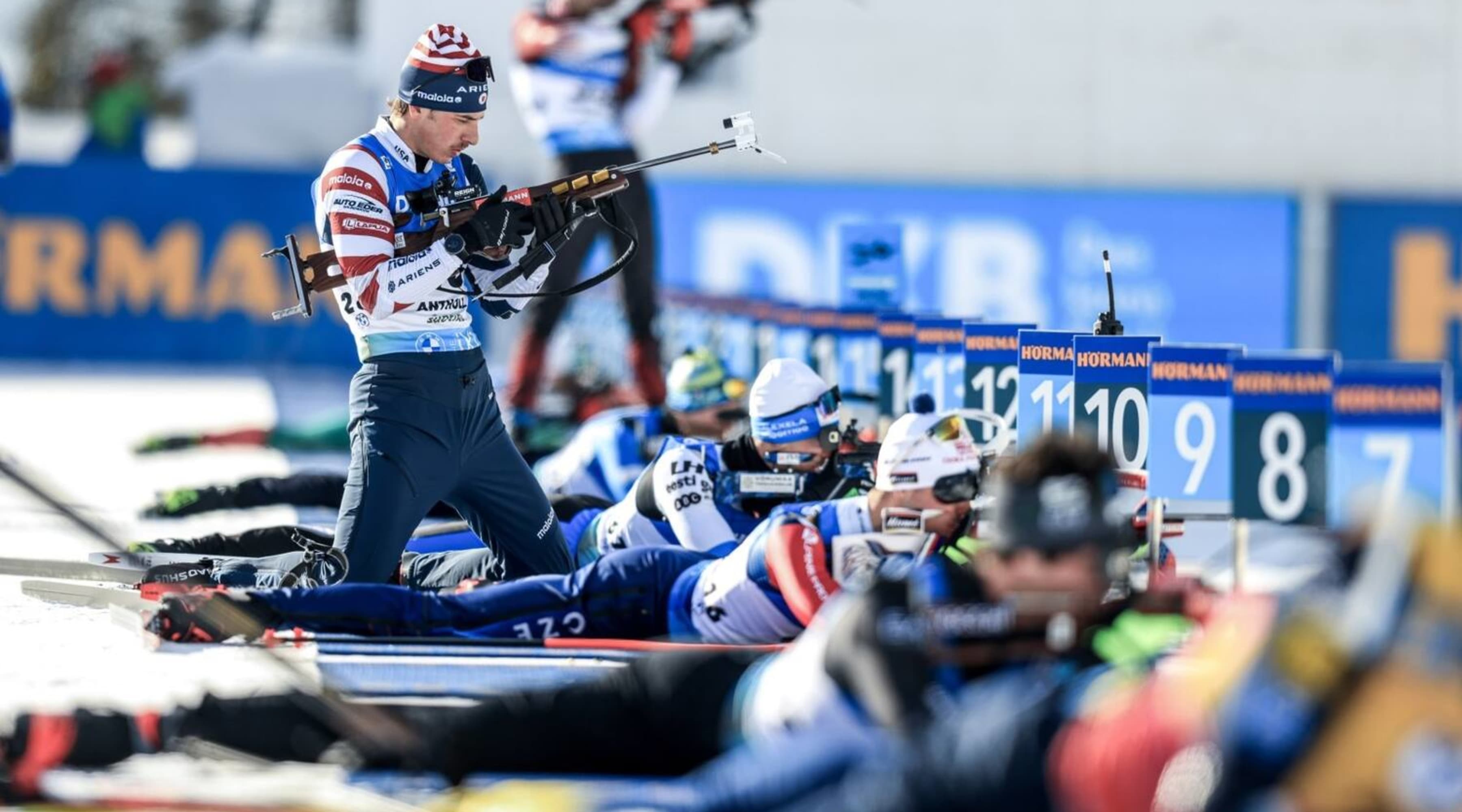 Paul Schommer prepares his rifle during a prone shooting stage at the 2023 World Cup in Antholz, Italy