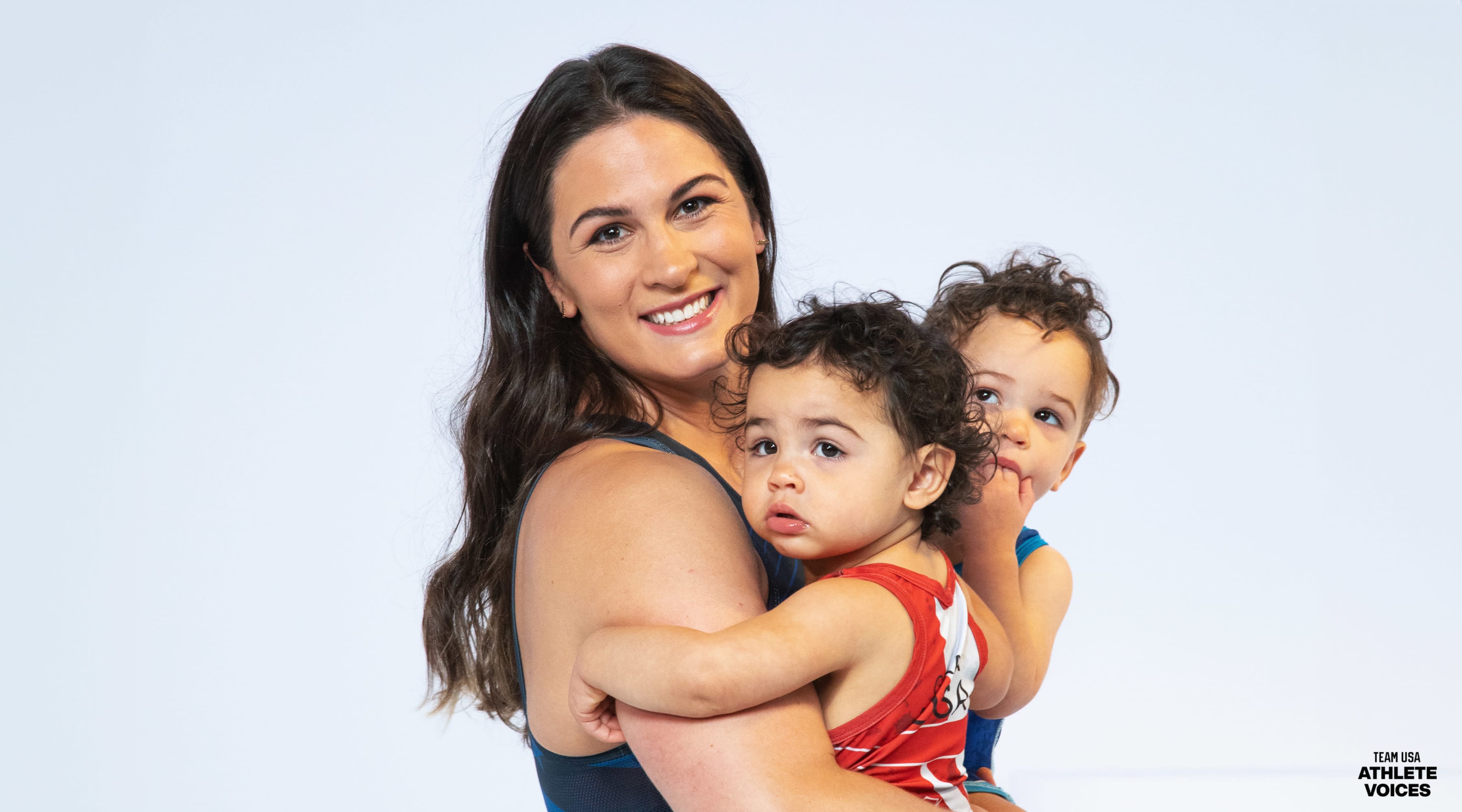 Adeline Gray poses on set with her twins at a shoot for Team USA in Los Angeles, California.