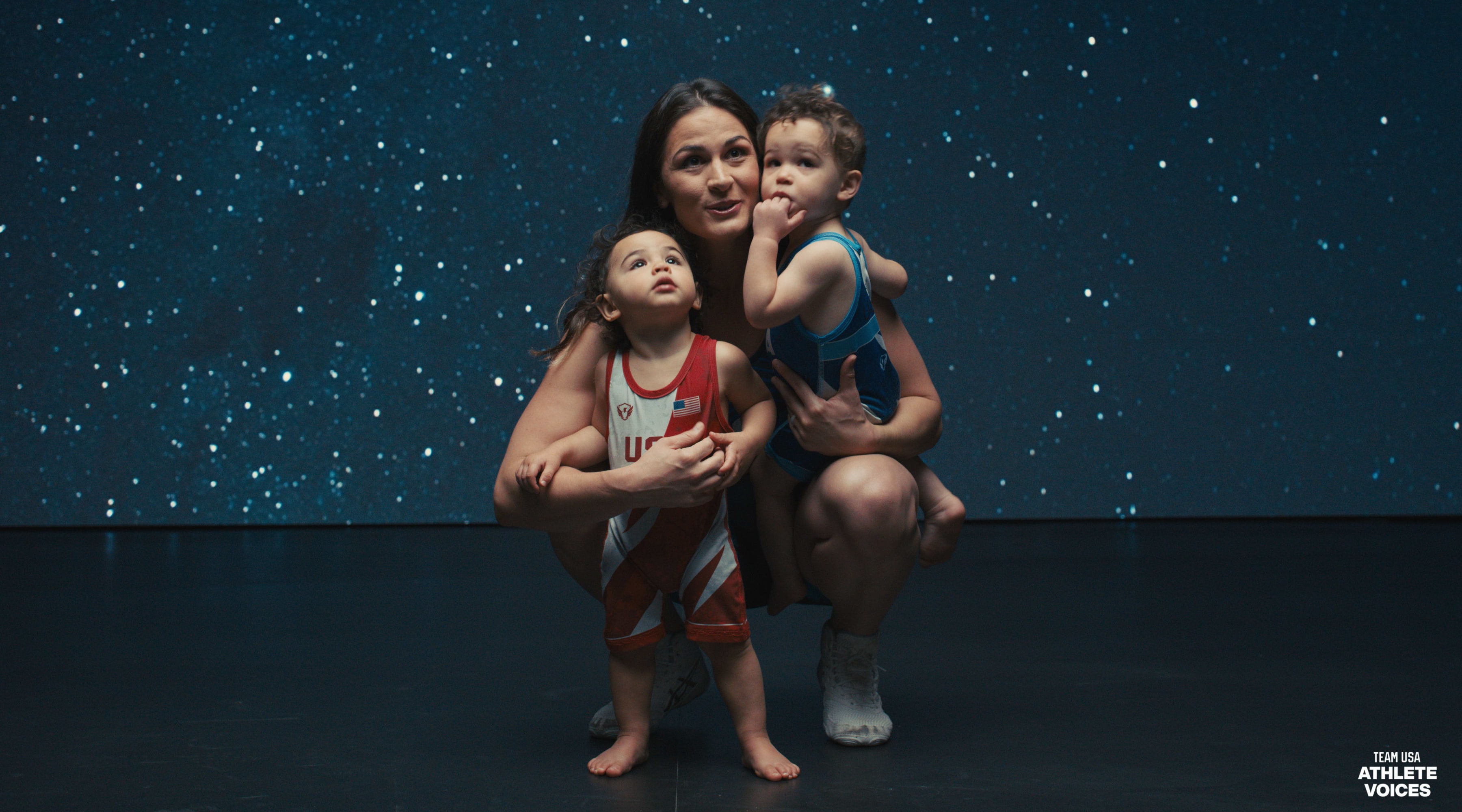 Adeline Gray poses on set with her children at a shoot for Team USA in Los Angeles, California.