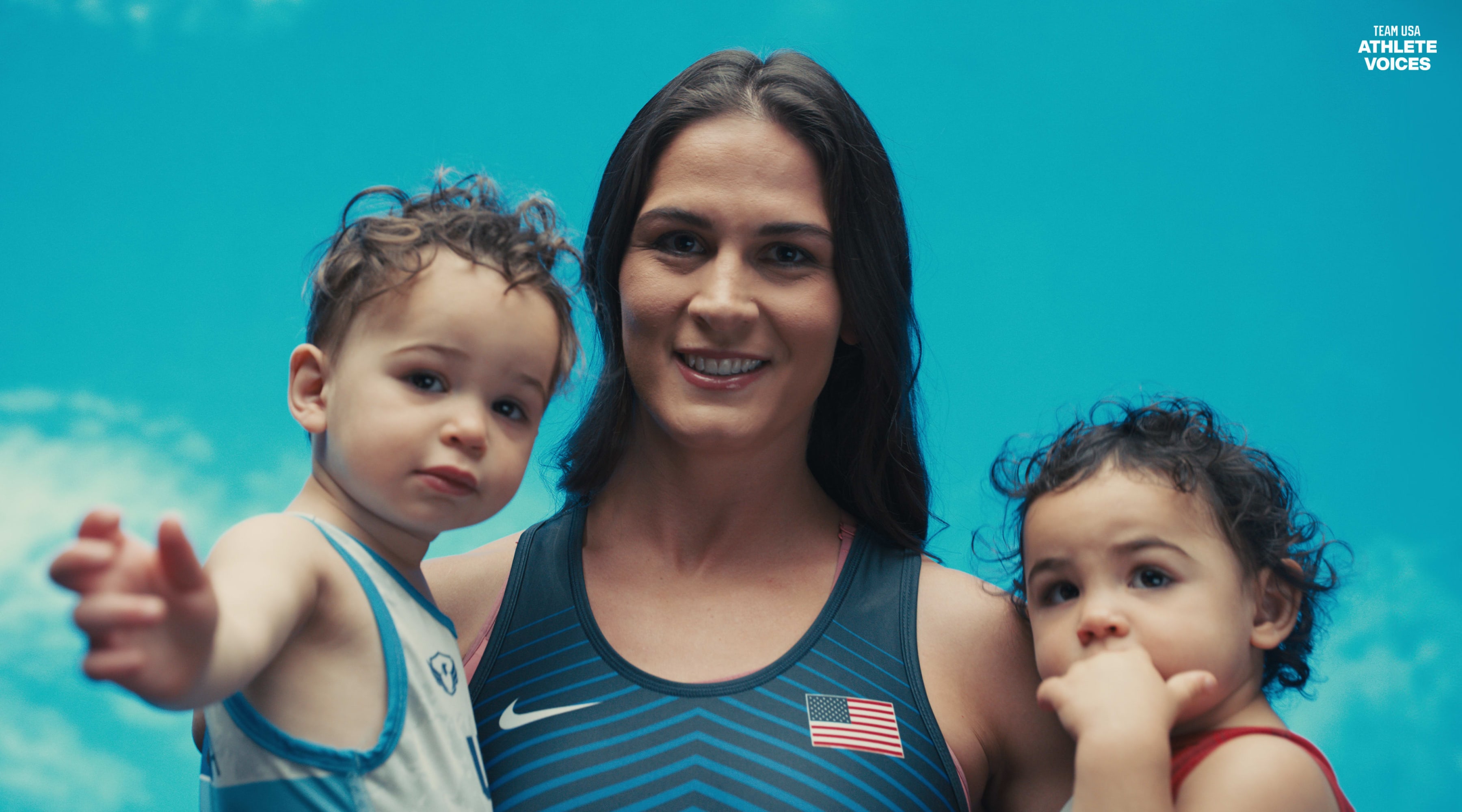 Adeline Gray poses on set with her children at a shoot for Team USA in Los Angeles, California.