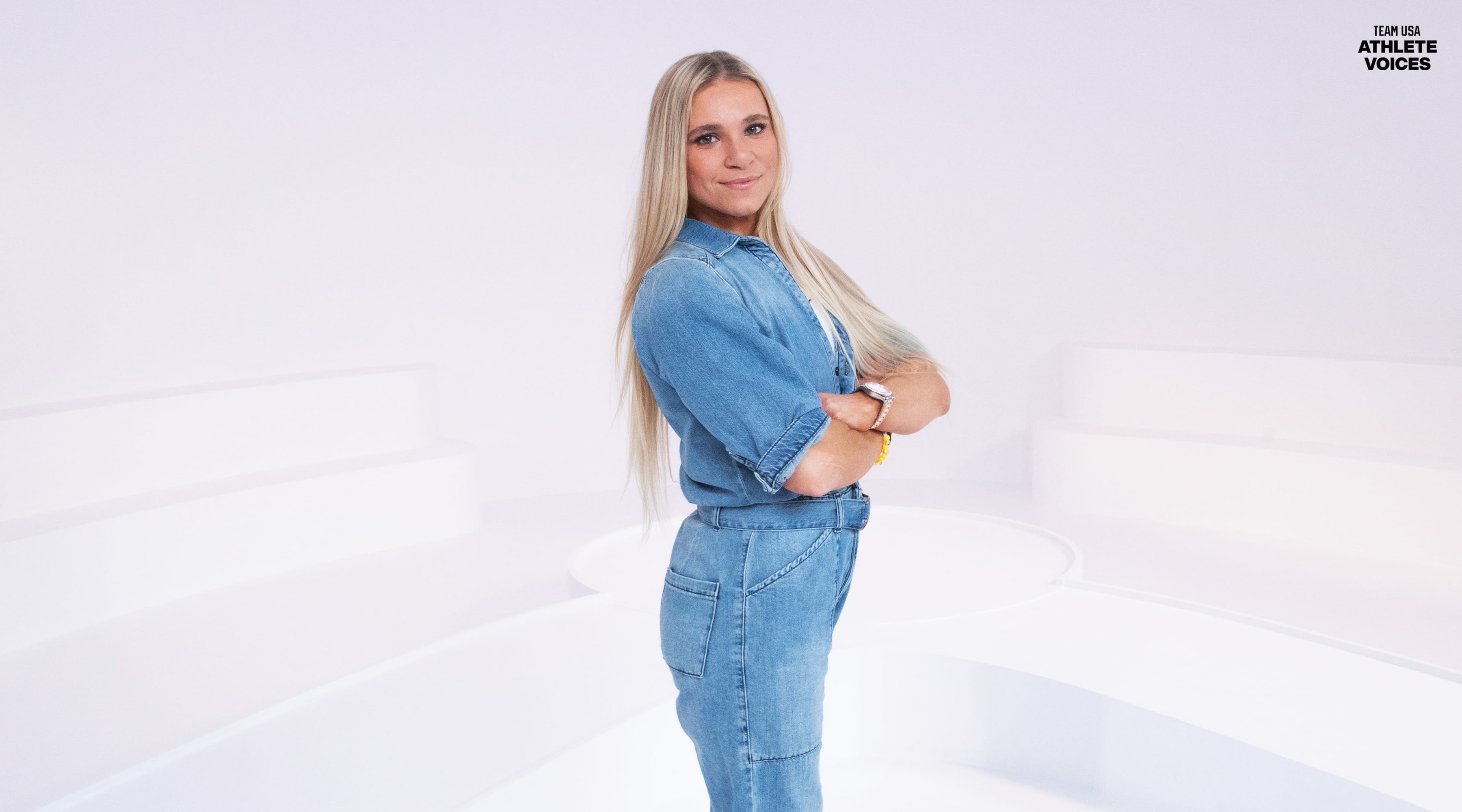 Oksana Masters poses on set, dressed in overalls for Team USA at a shoot in Los Angeles, California.