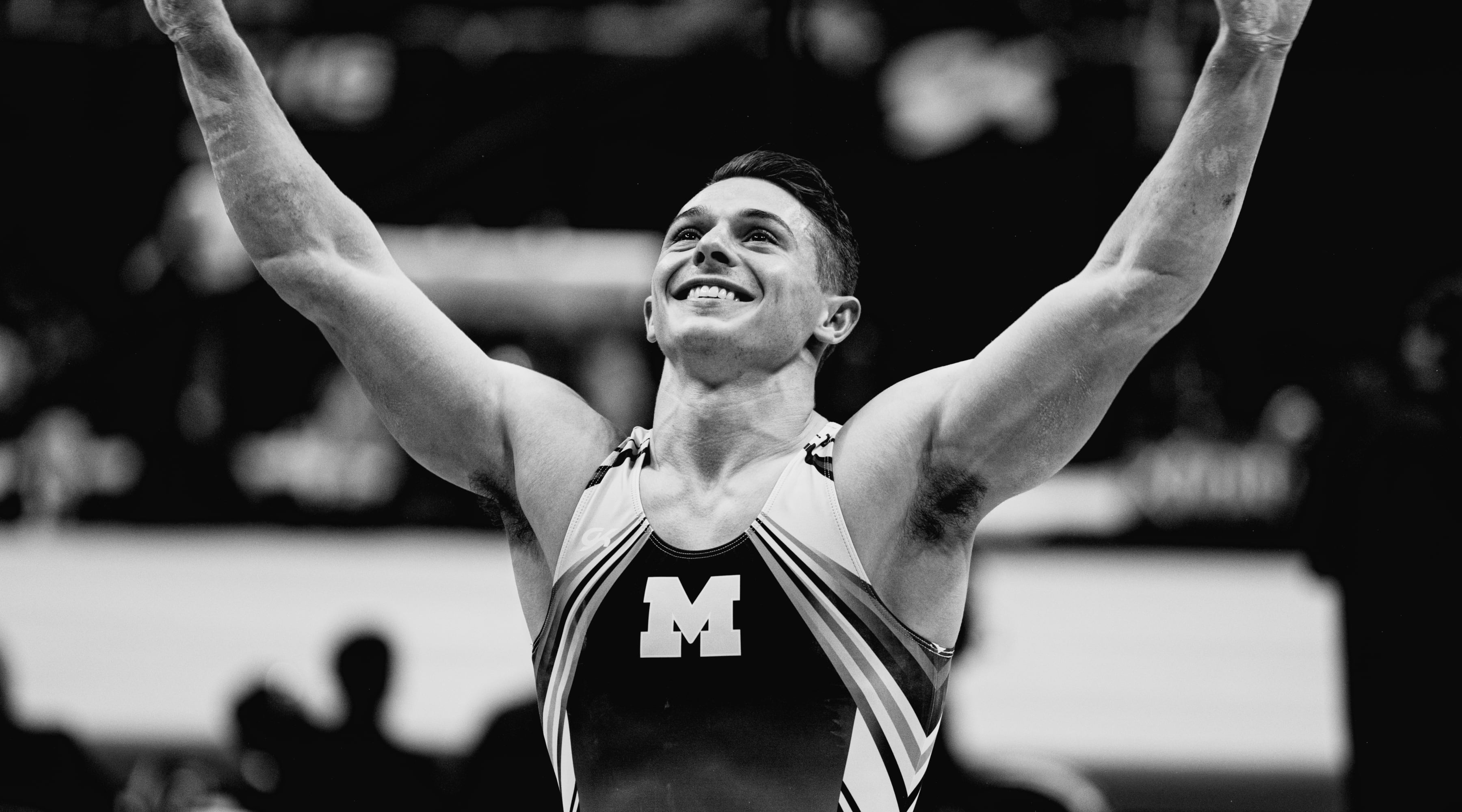 Paul Juda or University of Michigan celebrates after landing his Parallel Bars routine on night 1 of the US Gymnastics Championship 2023 in San Jose, California.