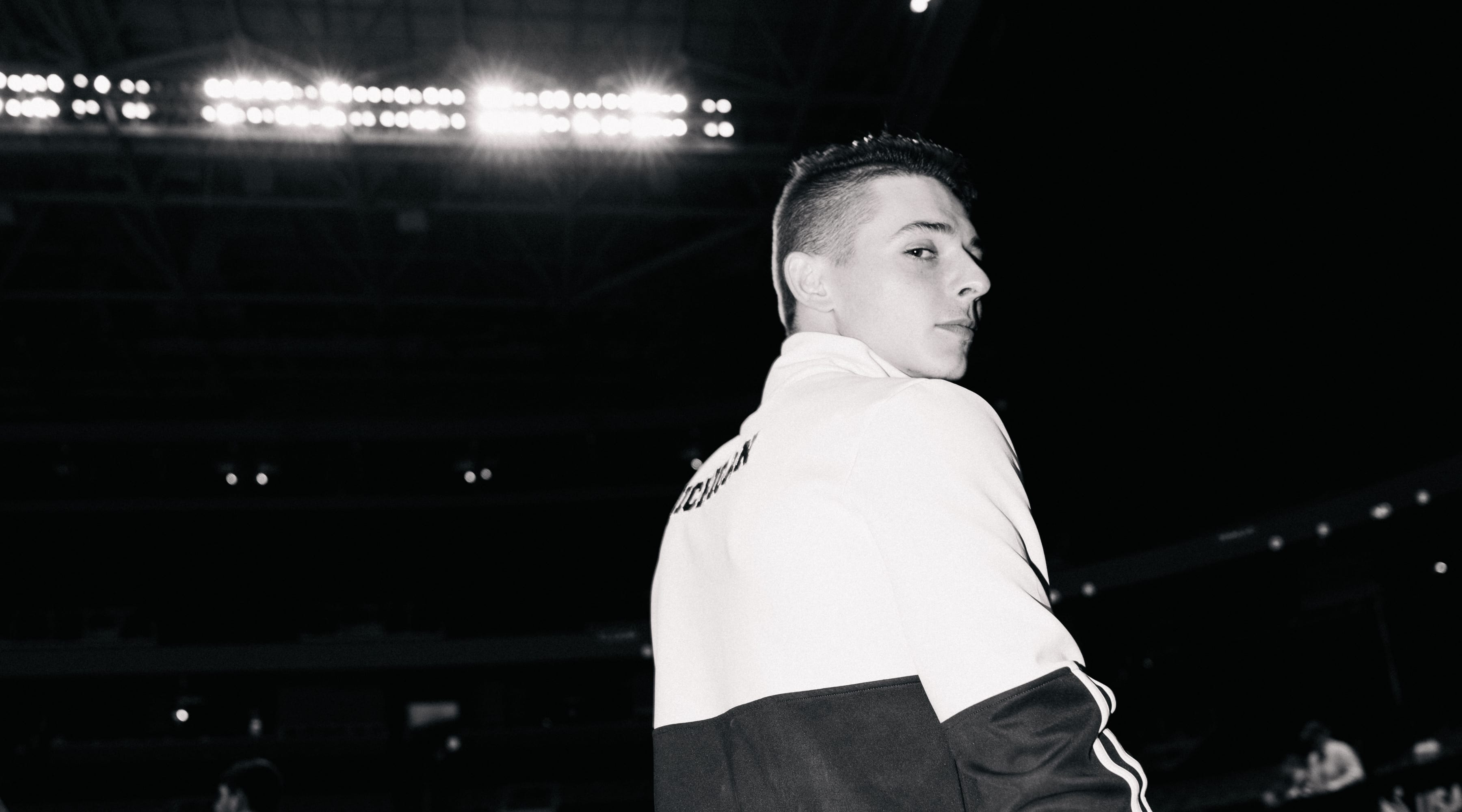 Paul Juda of the University of Michigan looks over his shoulder at the camera at the end of night 1 of mens competition at the US Gymnastics Championships 2023 in San Jose, California.