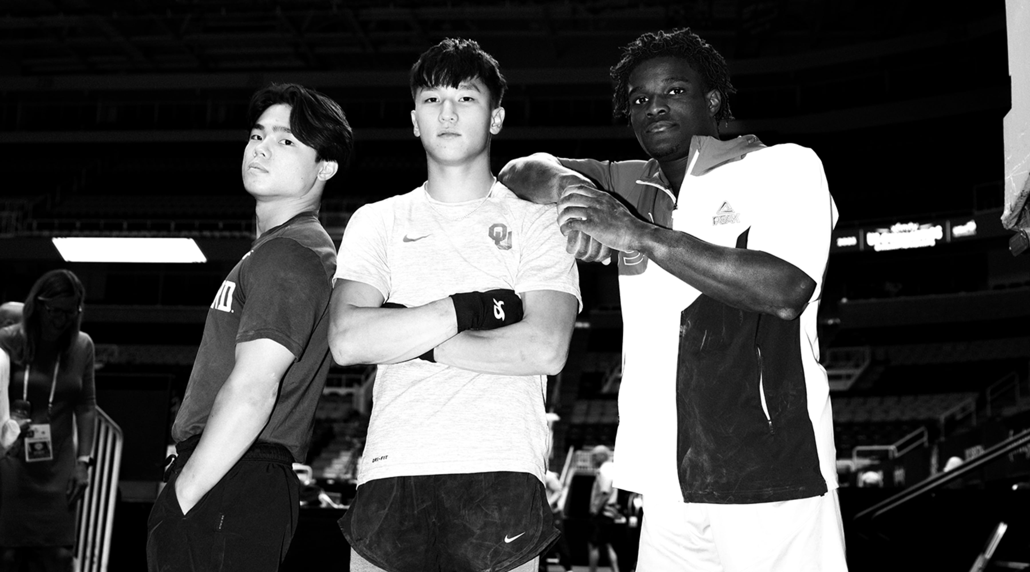 Fred Richard, Asher Hong and Yul Moldauer pose for a photograph on the mat after podium training at US Gymnastics Nationals 2023 in San Jose, California.