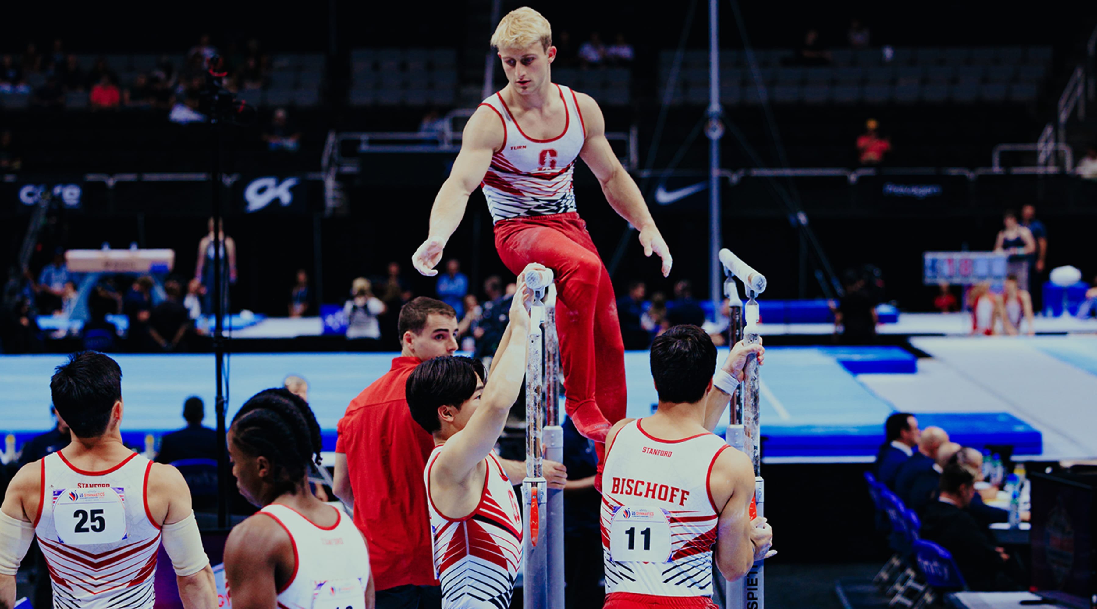 Stanford Mens Gymnastics team prepares the parallel bars for competition at the US Gymnastics Nationals 2023 in San Jose, California.