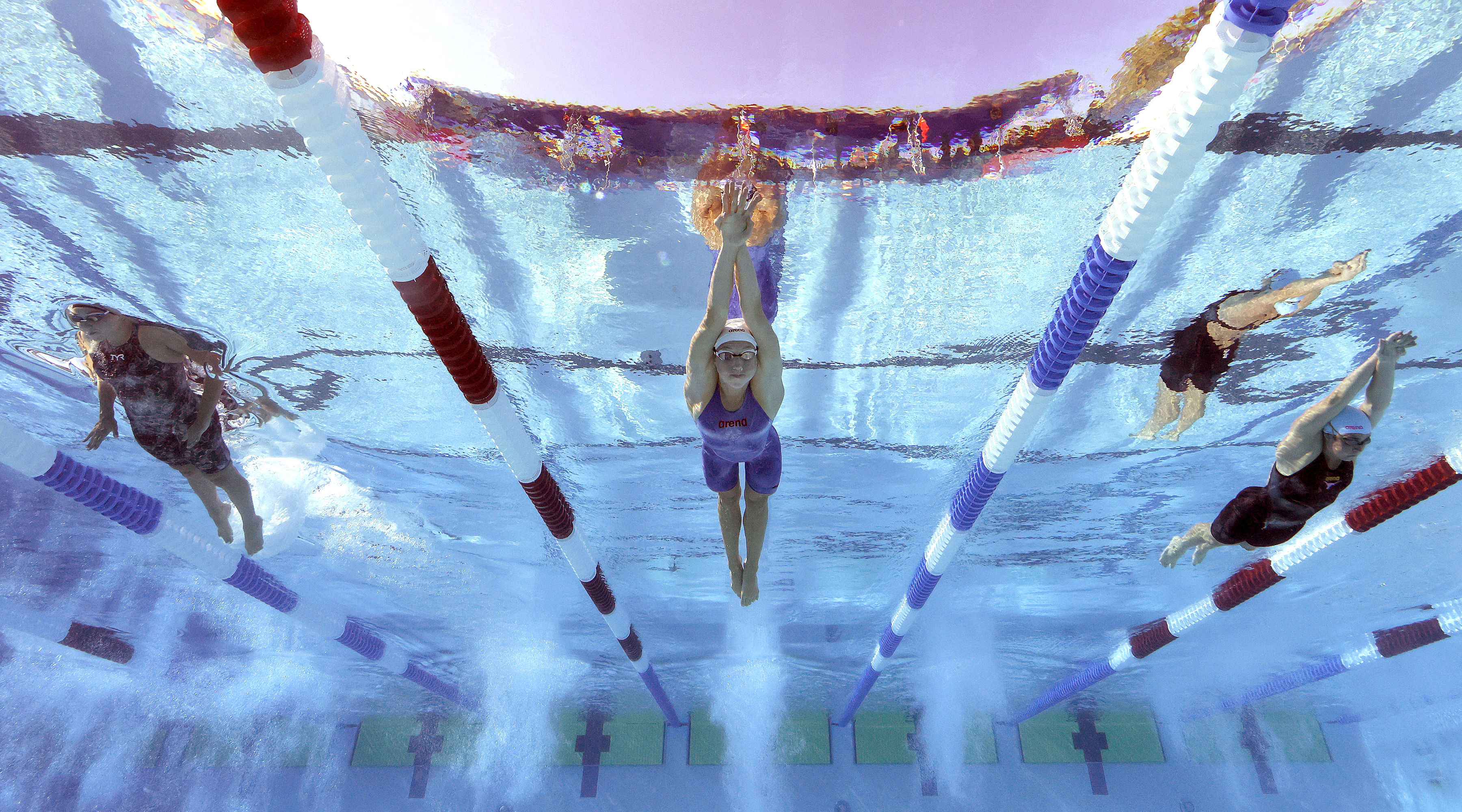 Gretchen Walsh swims during the women's 100-meter butterfly finals.