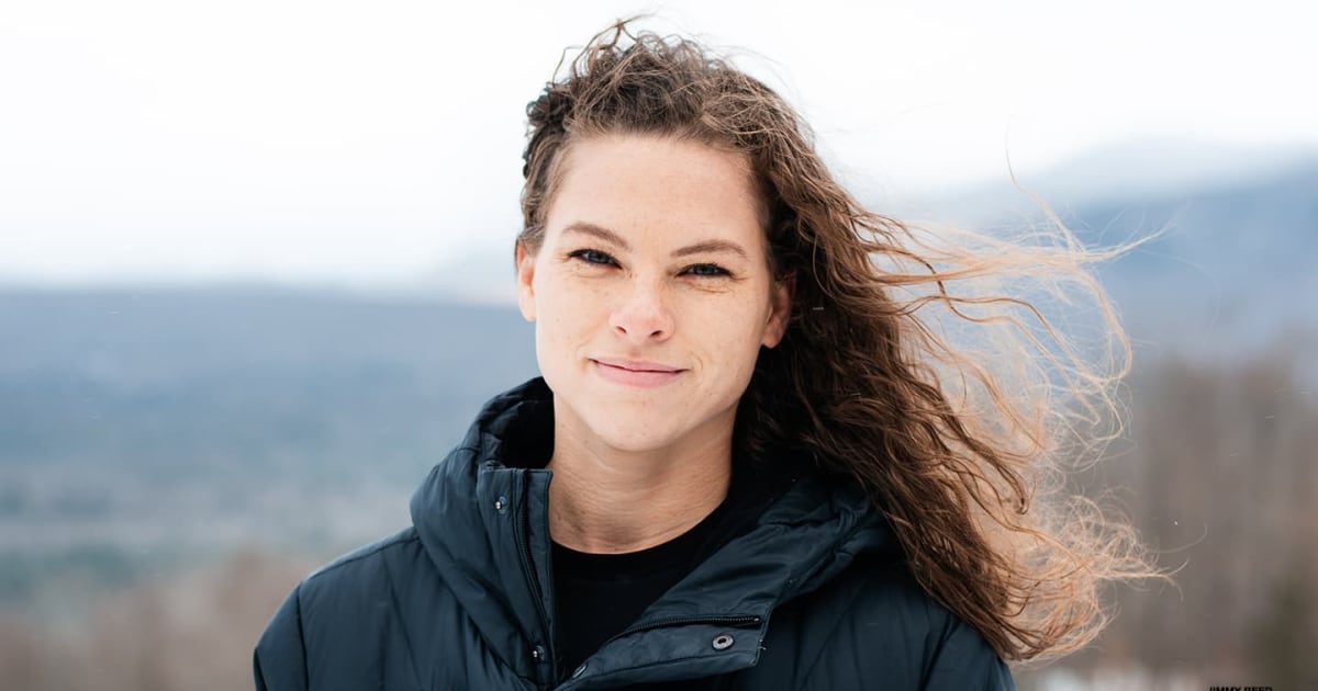 Smiling strong athletic woman with black skin and curly hair