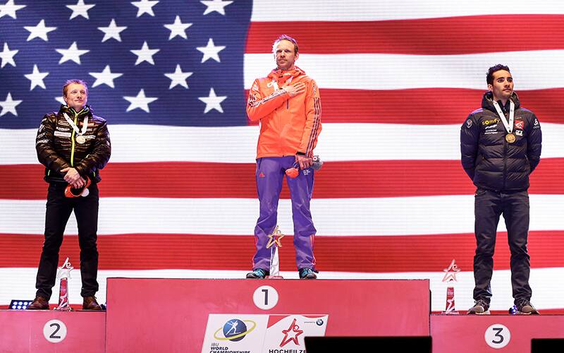 Lowell Bailey stands atop the podium at the Biathlon World Championships in Hochfilzen, Austria, on Feb. 16, 2017.