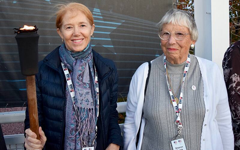 Sharon Evers (right) attends the torch lighting ceremony at OTC VIP Weekend.