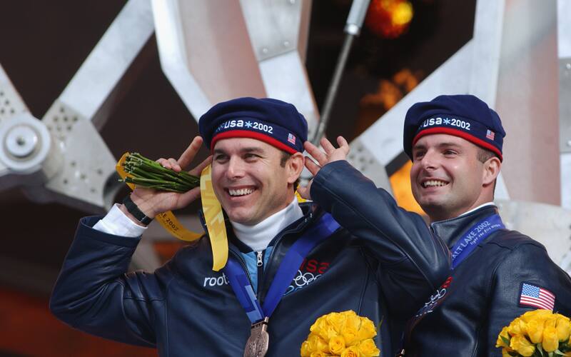 Brian Shimer stands with a teammate during the four-man bobsled medal ceremony at the Salt Lake City 2002 Olympic Winter Games.