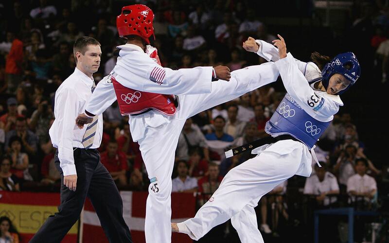 Nia Abdallah competes at the Athens 2004 Olympic Games, where she won a silver medal.