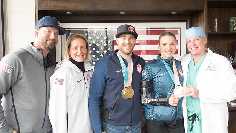 Mike Schultz and Oksana Masters return to the Steadman Clinic to show Dr. Marc Philippon their Paralympic medals