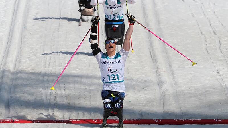 Oksana Masters crosses the finish line in the cross-country 1.1-kilometer sprint to become a Paralympic champion for the first time in her career.