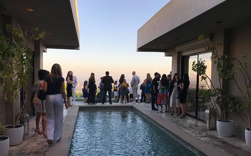 Team USA athletes network with entrepreneurs and businesspeople at the home of Alex Popa in Los Angeles, California.