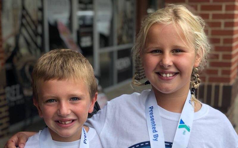 emma and her brother at the finish of a race