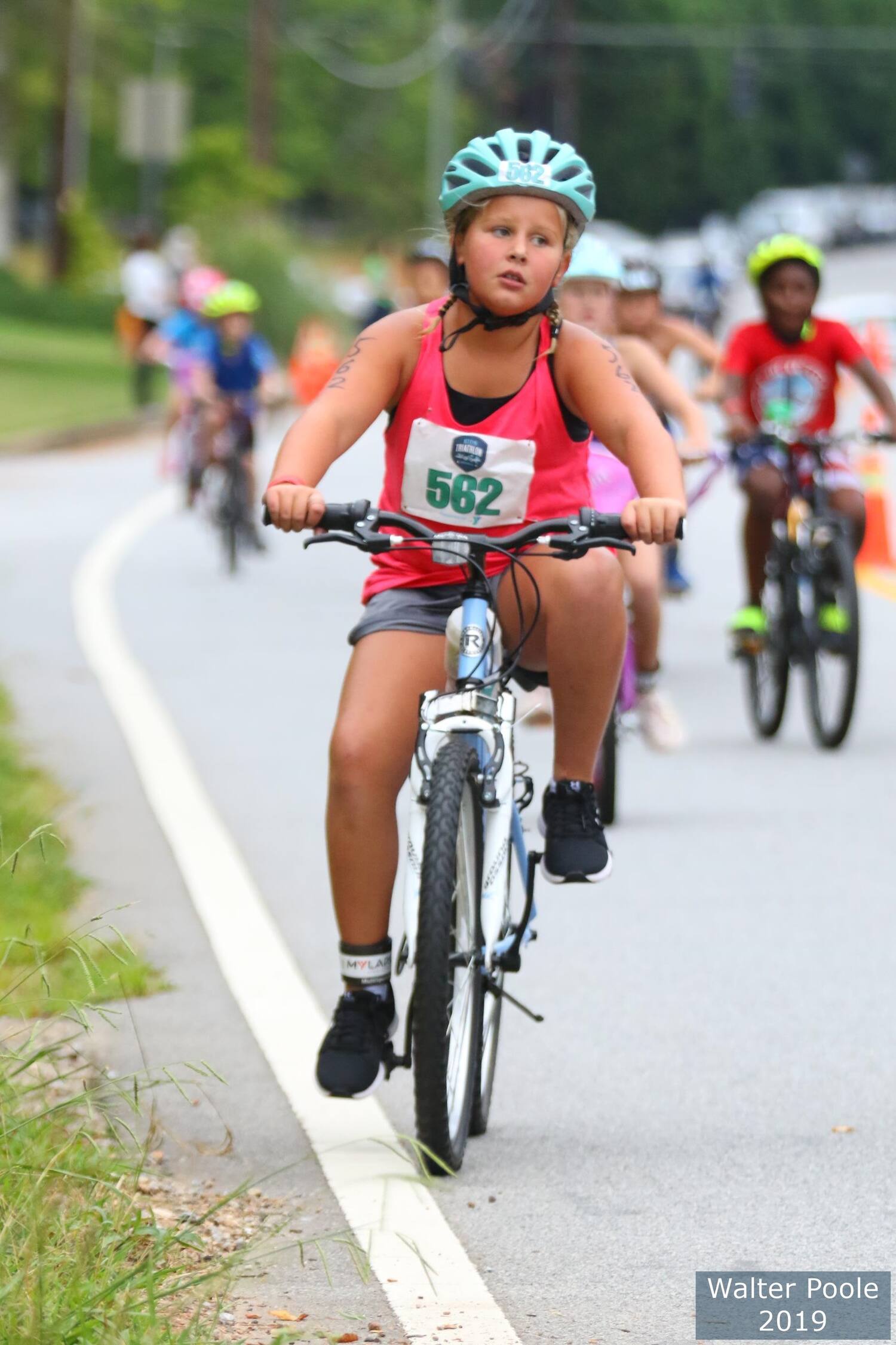 emma rides her bike in a triathlon race