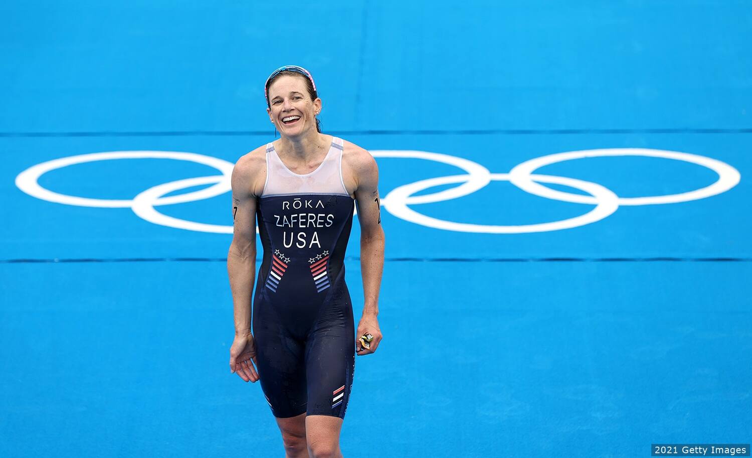 Katie zaferes smiles after she crosses the finish line at the Tokyo Olympics