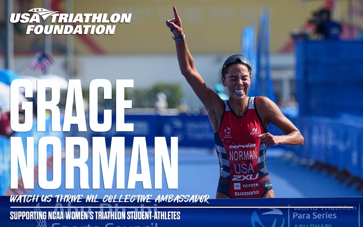 grace norman runs across the finish line raising her arm in the air and smiling
