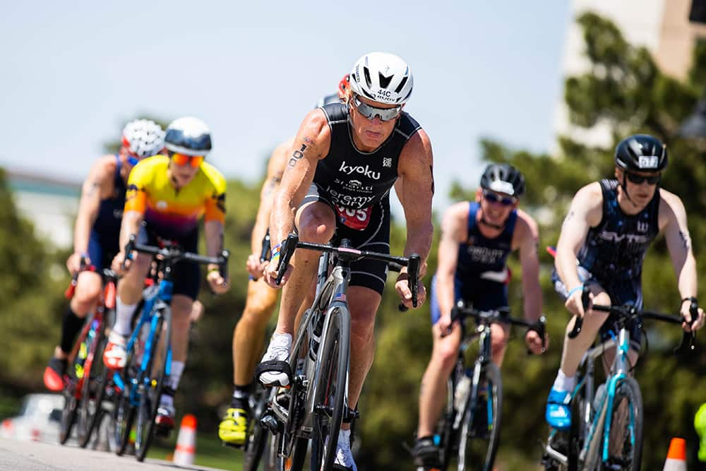 Athletes draft behind one another during the bike portion of a draft-legal race.