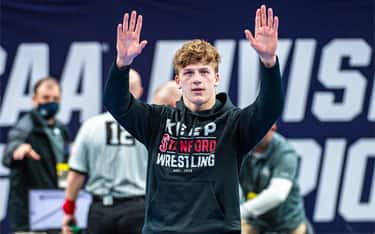 NCAA champion Shane Griffith of Stanford waves to crowd, wearing his Keep Stanford Wrestling sweatshirt