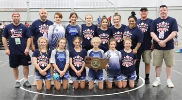 Pennsylvania, the 14U Girls National Duals champion, pose with their trophy