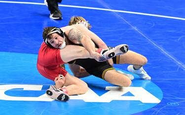 Jaydin Eierman of Iowa hits a double leg at session one of 2021 NCAA Championships in St. Louis