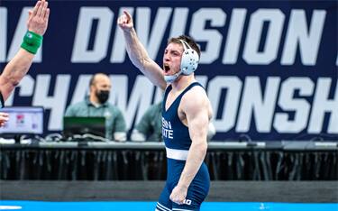 Nick Lee of Penn State points to the crowd after winning the 2021 NCAA title at 141 pounds.