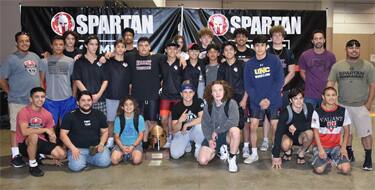 Valiant Prep Greco-Roman team poses with its trophy after winning Spartan Nationals Greco-Roman Duals