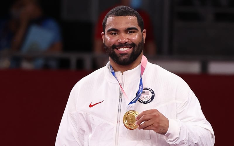 Gable Steveson with his Olympic gold medal on the podium in Tokyo