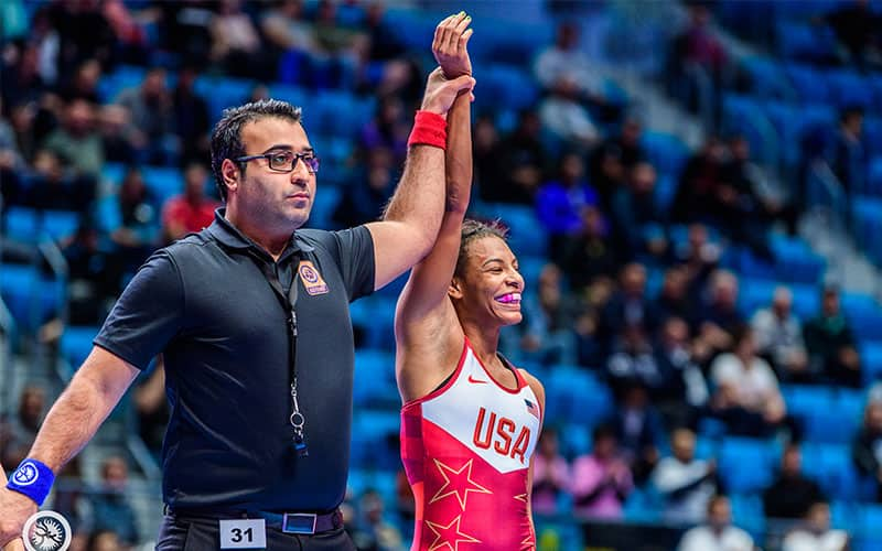 Jacarra Winchester (USA) with arm raised in victory