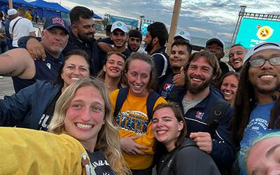 Athletes from the USA and Azerbaijan pose together at 2022 Beach World Series Final