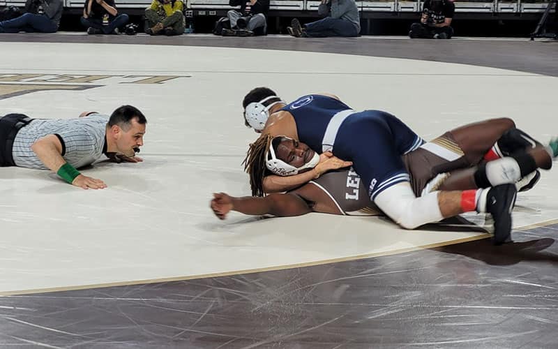Shane Van Ness (PSU) works for the pin.