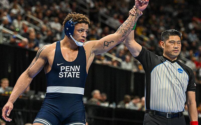 Greg Kerkvliet (Penn State) with his arm raised in victory