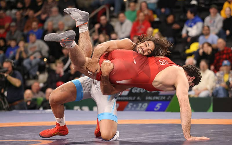 Zahid Valencia (USA) scores a takedown against Georgia at the 2022 World Cup.