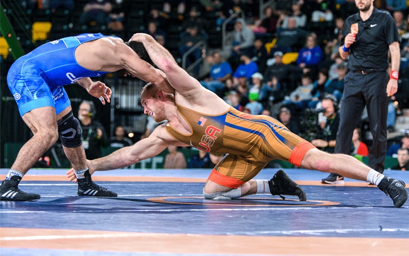 Kyle Snyder (USA) shoots on Kamran Ghasempour (Iran) in 2022 World Cup finals dual.