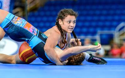 Katy Valdez of Colorado pins her opponent in a chest-to-chest hold.