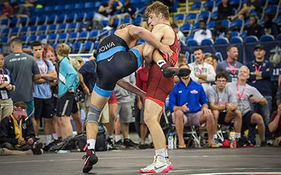 Connor Mirasola (WI) secures a high single leg in the Junior Nationals semifinals.