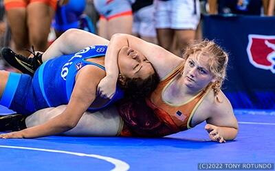 Sam Calkins of California works to pin her opponent.