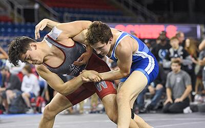 Q’veli Quintanilla of Washington controls the overhook and wrist