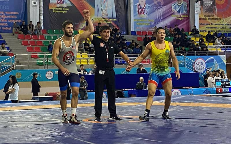 Tyler Berger (USA) with arm raised after a win at the Kunaev D.A. International in Kazakhstan