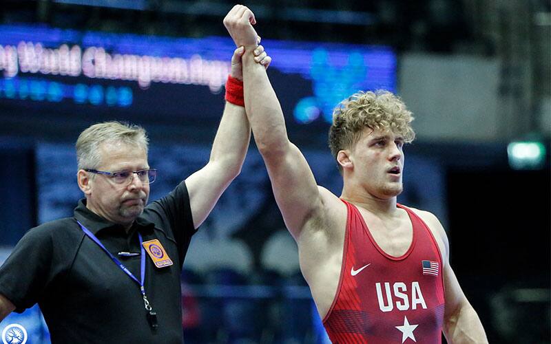 Trent Hidlay (USA) has his arm raised in victory