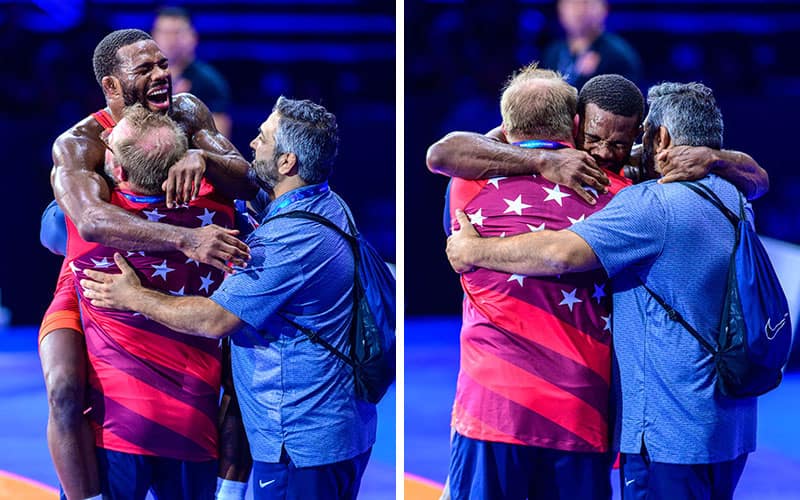 Jordan Burroughs celebrates his World title with coaches Brandon Slay and Bill Zadick.