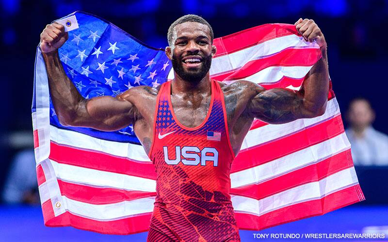 Jordan Burroughs with the American flag after winning a 2022 World gold medal.