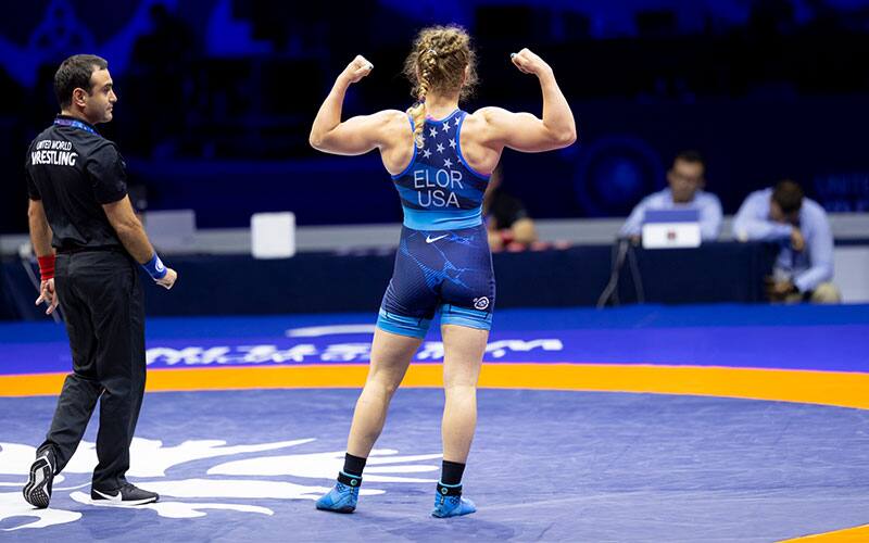 Amit Elor (USA) flexes after a win at the 2022 Senior Worlds.