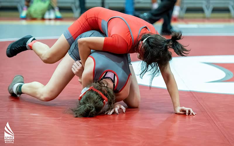 Girls wrestling image, with SPIRE Women's wrestling logo