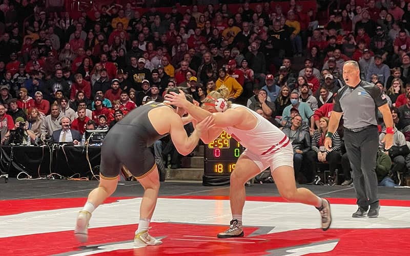 Tony Cassioppi (Iowa) and Trent Hillger (Wisconsin) square off at heavyweight.